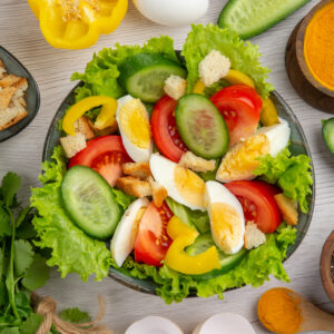 top view vegetable salad with eggs greens seasonings white background meal food ripe color